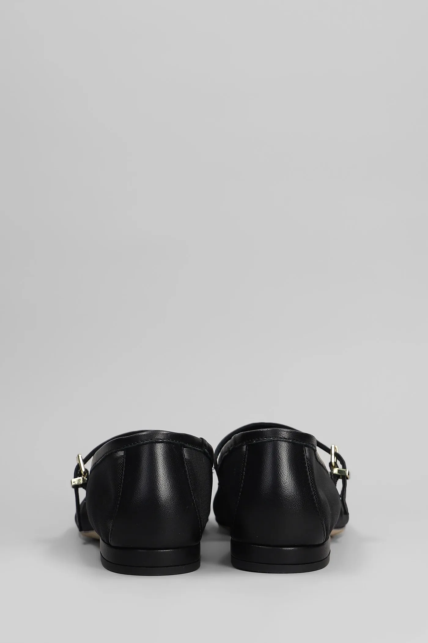 Ballet flats in black leather and fabric